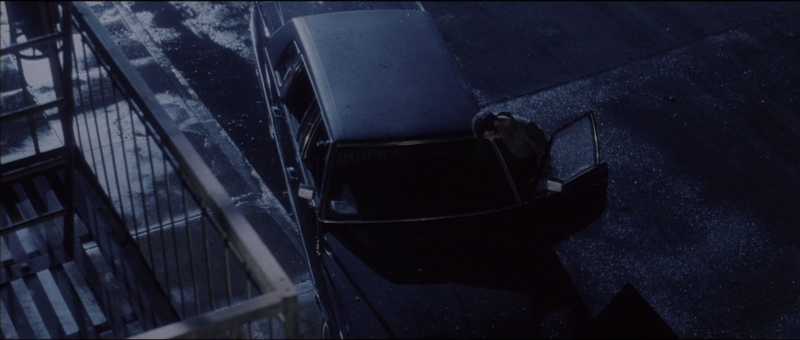 (1:36:16) He pulls over in front of this building and honks the horn.